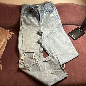 Wide legged ripped jeans. Light blue in very good condition. 30 inseam inch
